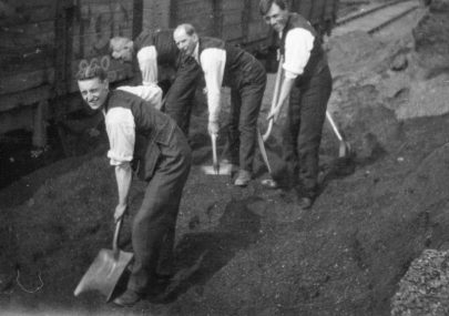 Office workers emptying wagons during miner's strike